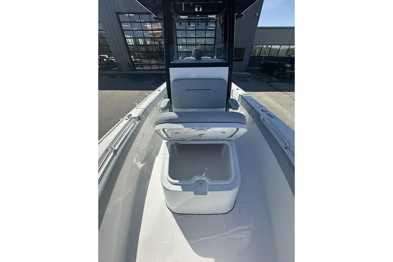 Slide: The Image of 2026 Sportsman Masters 247 Bay Boat interior with open storage compartment. - 7