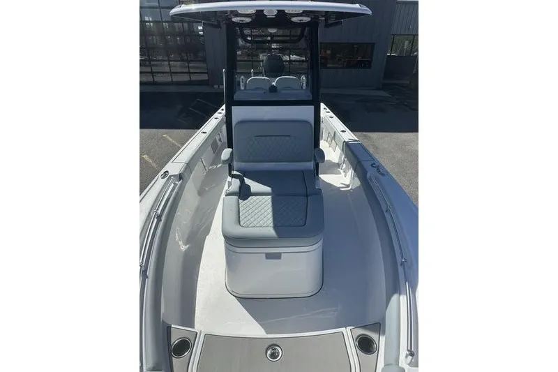 Slide: The Image of 2026 Sportsman Masters 247 Bay Boat interior with cushioned seating and sleek design. - 8