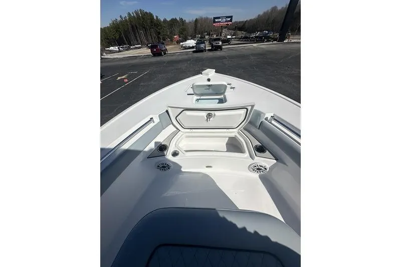 Slide: The Image of 2026 Sportsman Masters 247 Bay Boat interior with open storage compartments. - 9