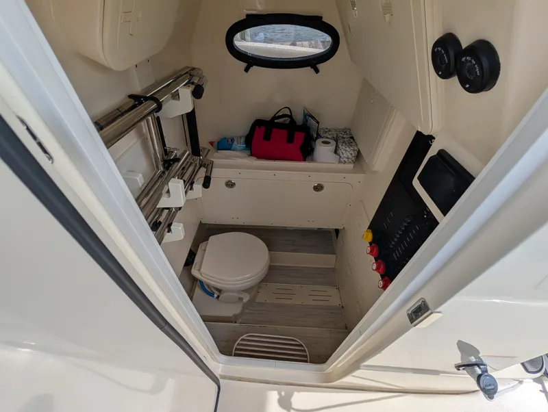 Slide: The Image of Interior of 2024 Scout 277 LXF featuring toilet and storage area. - 37
