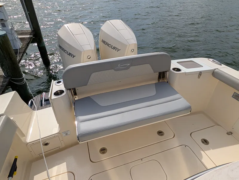 Slide: The Image of 2024 Scout 277 LXF boat with Mercury engines at dock. - 39