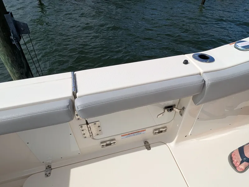 Slide: The Image of 2024 Scout 277 LXF boat rear view by the water. - 41