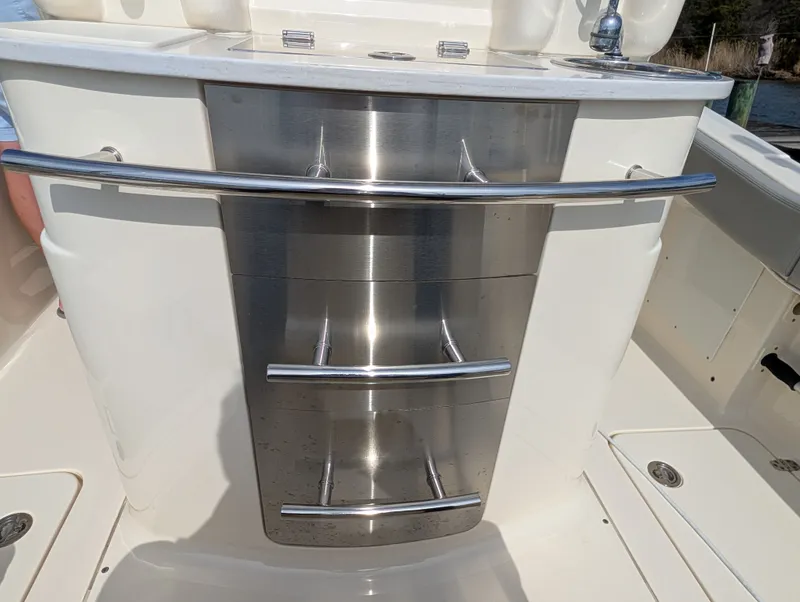 Slide: The Image of 2024 Scout 277 LXF boat galley with stainless steel drawers. - 42