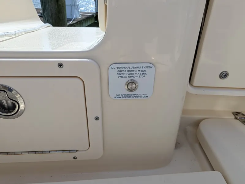 Slide: The Image of 2024 Scout 277 LXF boat with outboard flushing system. - 44