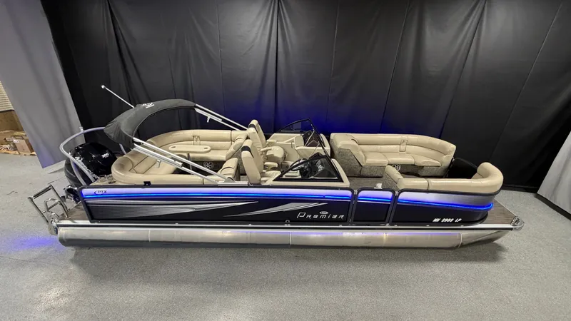 Slide: The Image of 2017 Premier 270 S-Series pontoon boat with blue lighting. - 1