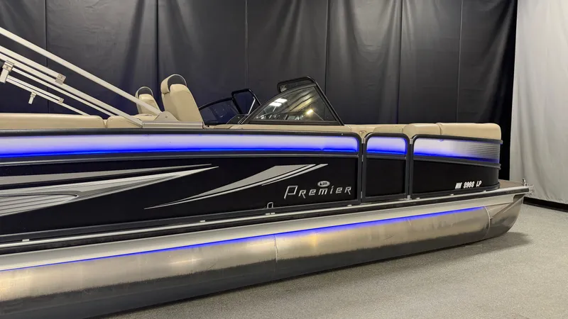 Slide: The Image of 2017 Premier 270 S-Series pontoon boat with blue lighting. - 3