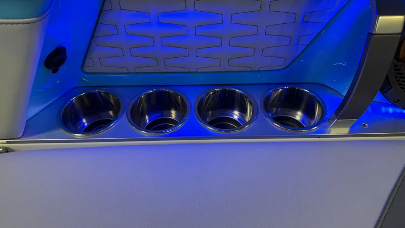 Slide: The Image of 2019 MasterCraft X24 boat with blue LED lighting and cup holders. - 40