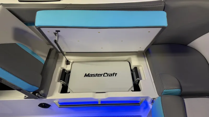 Slide: The Image of MasterCraft X24 2019 seat storage with blue lighting. - 45