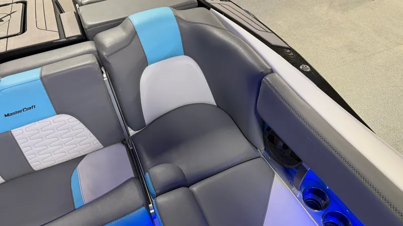 Slide: The Image of Interior of a 2019 MasterCraft X24 boat with blue and gray seating. - 48