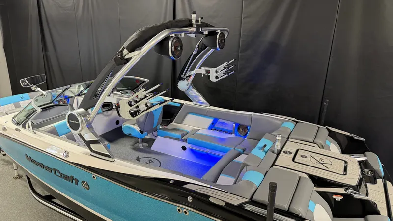 Slide: The Image of 2019 MasterCraft X24 boat with blue and gray interior, LED lighting. - 7