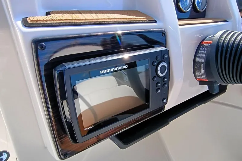 Slide: The Image of Helix 5 fish finder on 2026 Starcraft SVX 230 DC OB dashboard. - 13