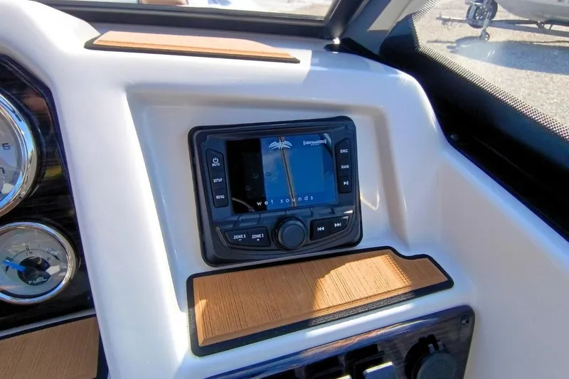 Slide: The Image of 2026 Starcraft SVX 230 DC OB dashboard with audio controls and gauges. - 16