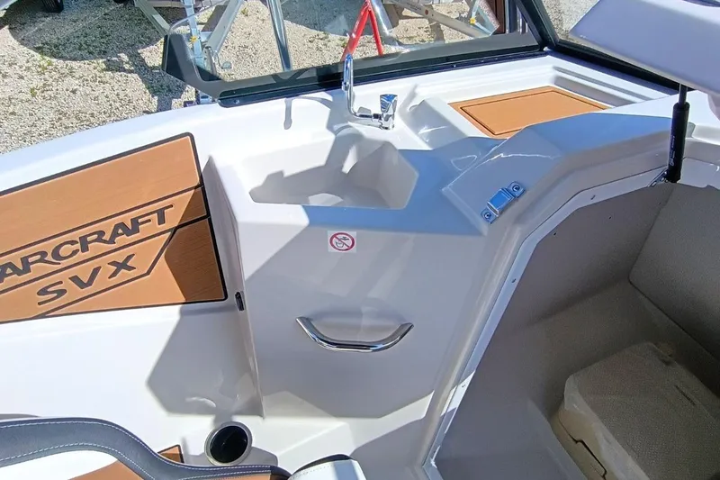 Slide: The Image of 2026 Starcraft SVX 230 DC OB boat interior with sink and storage compartment. - 22