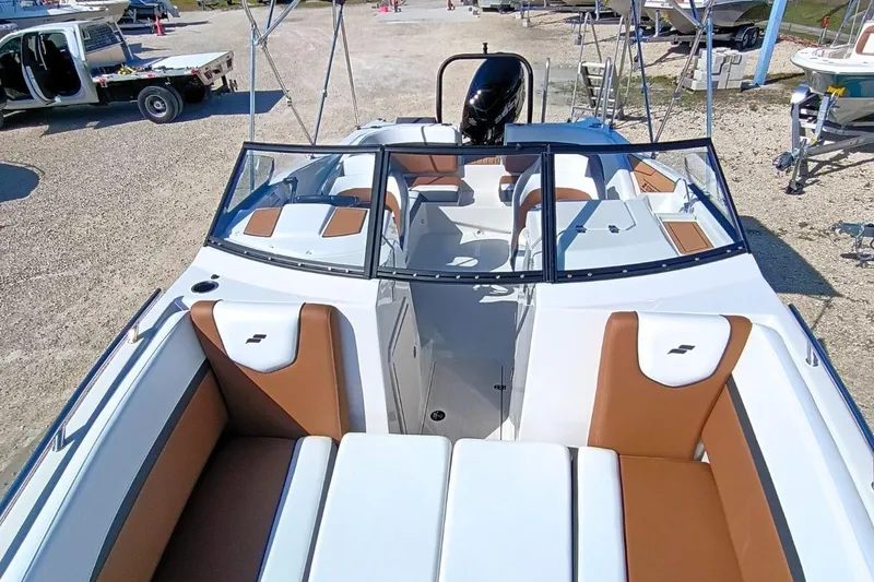 Slide: The Image of 2026 Starcraft SVX 230 DC OB boat interior with brown and white seating. - 31