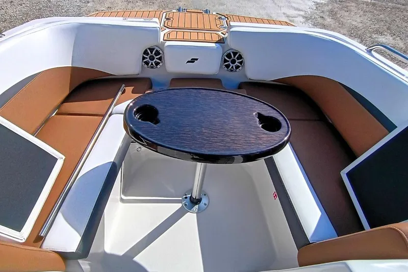 Slide: The Image of 2026 Starcraft SVX 230 DC OB boat interior with seating and table. - 32