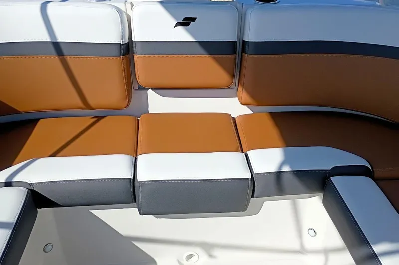 Slide: The Image of 2026 Starcraft SVX 230 DC OB boat seating with brown and white upholstery. - 36