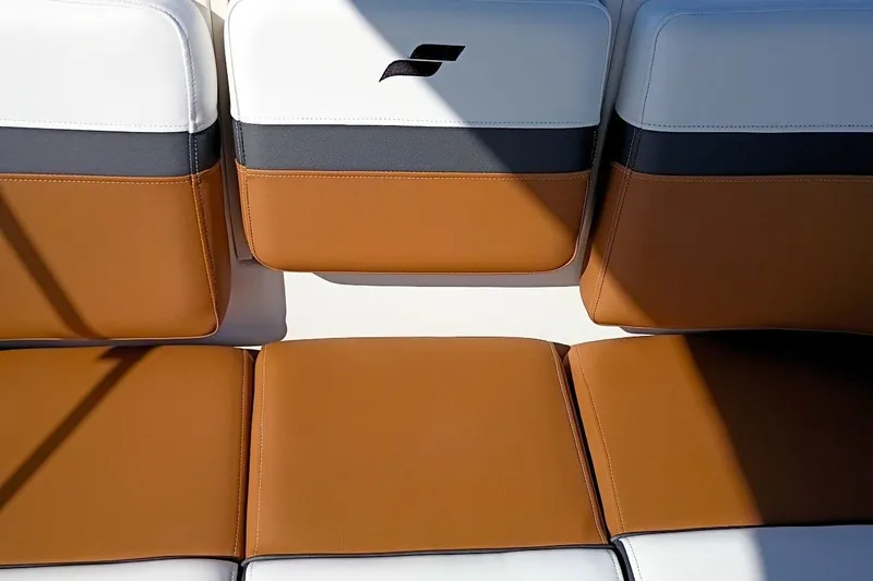 Slide: The Image of 2026 Starcraft SVX 230 DC OB boat seating with brown and white upholstery. - 40
