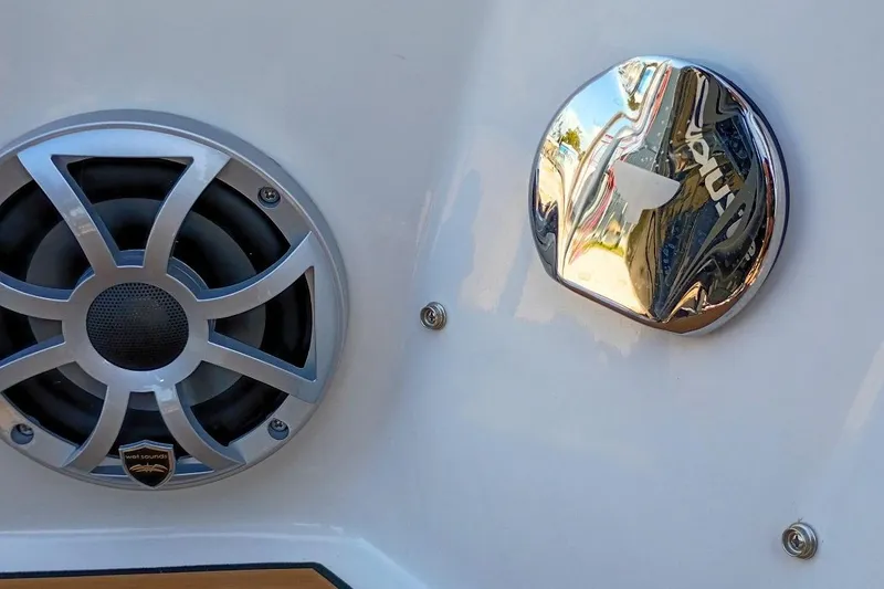 Slide: The Image of 2026 Starcraft SVX 230 DC OB boat speaker and chrome detail on white surface. - 44