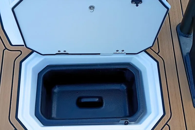 Slide: The Image of Open storage compartment on 2026 Starcraft SVX 230 DC OB boat deck. - 50