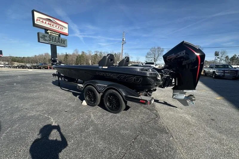 Slide: The Image of 2026 Nitro Z20 XL Pro boat with powerful engine, parked outdoors under clear sky. - 3