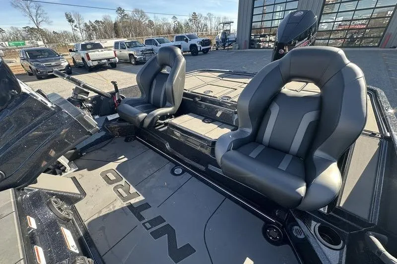 Slide: The Image of 2026 Nitro Z20 XL Pro boat interior with two seats and steering console. - 5