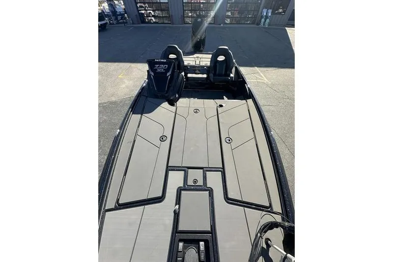 Slide: The Image of 2026 Nitro Z20 XL Pro boat deck with seating and storage compartments. - 6