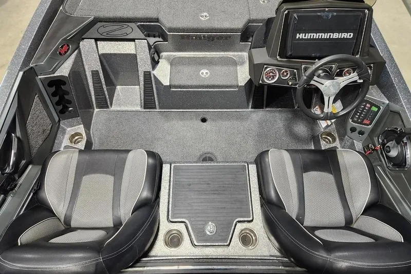 Slide: The Image of 2022 Ranger Z519 boat interior with dual seats, steering wheel, and Humminbird display. - 11