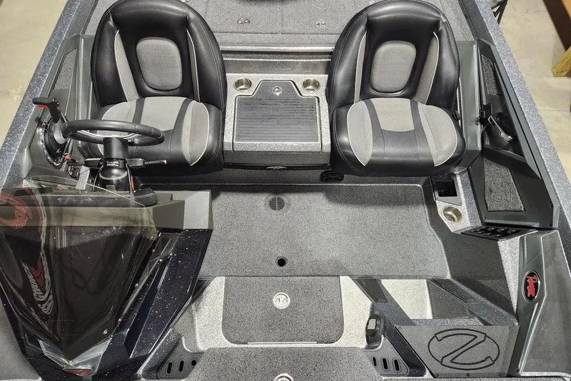 Slide: The Image of 2022 Ranger Z519 boat interior with dual seats and steering console. - 8