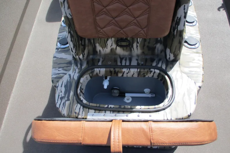 Slide: The Image of 2026 Avid 20 Rogue CC boat seat with camo design and storage compartment. - 11