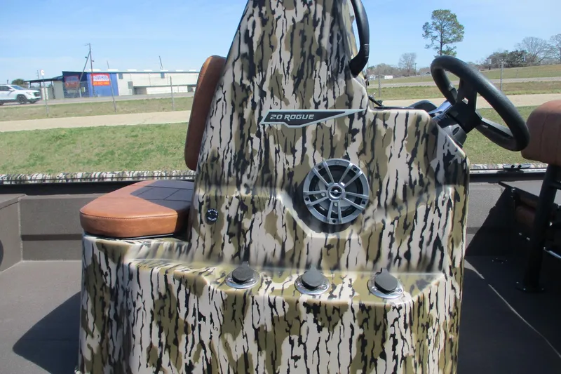 Slide: The Image of 2026 Avid 20 Rogue CC boat console with camouflage design and steering wheel. - 17