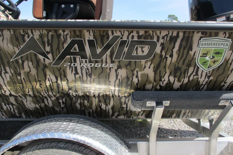 Slide: The Image of Avid 20 Rogue CC 2026 boat with camouflage design and Gamekeeper logo. - 19