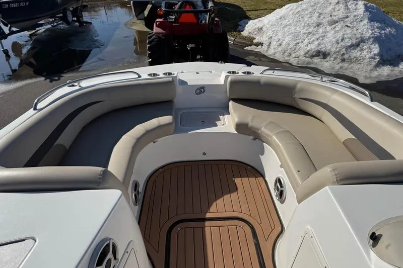 Slide: The Image of 2018 Hurricane SunDeck Sport 188 IO boat interior with cushioned seating and wood-style flooring. - 11