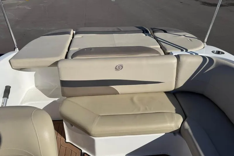Slide: The Image of 2018 Hurricane SunDeck Sport 188 IO boat interior with beige seating and sleek design. - 7