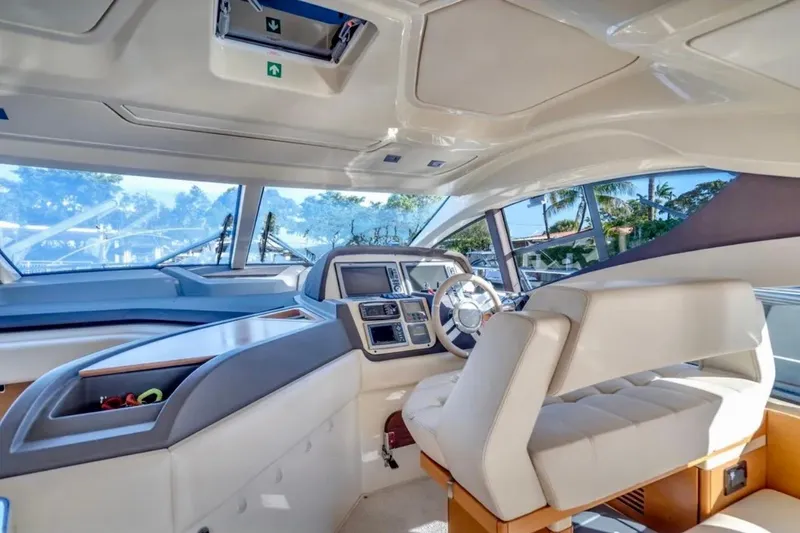 Slide: The Image of Interior of 2013 Azimut 45 yacht, featuring modern helm and luxurious seating. - 14
