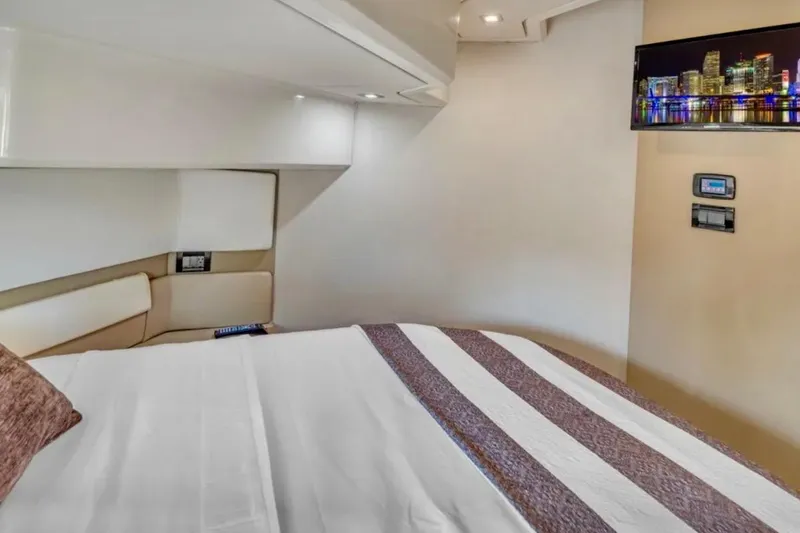 Slide: The Image of Luxurious bedroom interior of 2013 Azimut 45 yacht with modern decor and wall-mounted TV. - 21