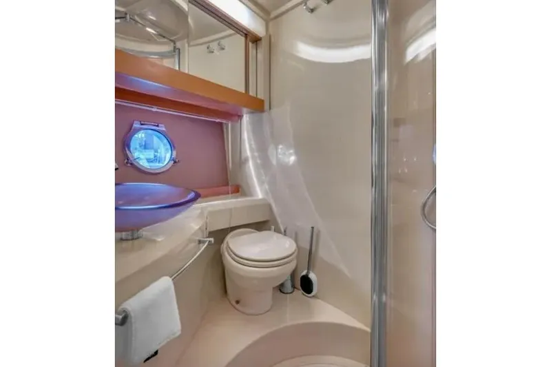 Slide: The Image of Luxurious bathroom in 2013 Azimut 45 yacht with modern fixtures and porthole window. - 23