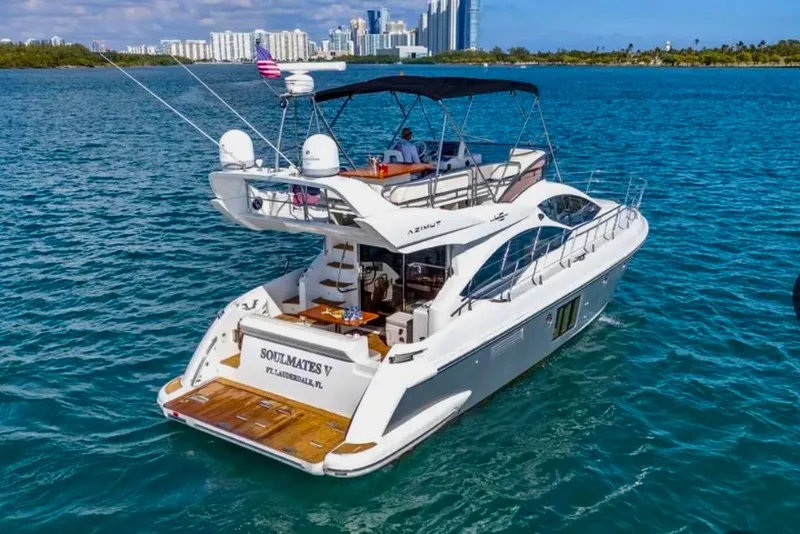 Slide: The Image of 2013 Azimut 45 yacht cruising in blue waters near city skyline. - 6