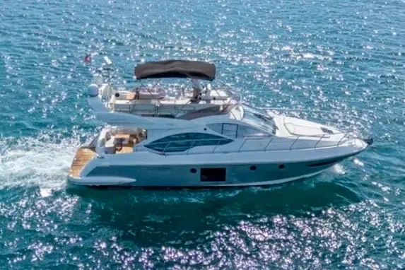 Slide: The Image of 2013 Azimut 45 yacht cruising on open blue waters. - 7