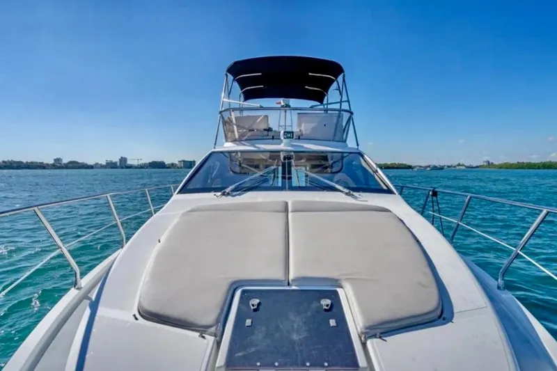 Slide: The Image of 2013 Azimut 45 yacht cruising on clear blue waters under a sunny sky. - 8