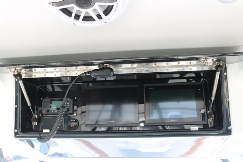 Slide: The Image of 2008 Yellowfin 42 Offshore boat dashboard with Garmin navigation displays and communication equipment. - 15