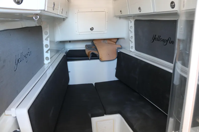 Slide: The Image of Interior cabin of 2008 Yellowfin 42 Offshore boat with seating and storage. - 18