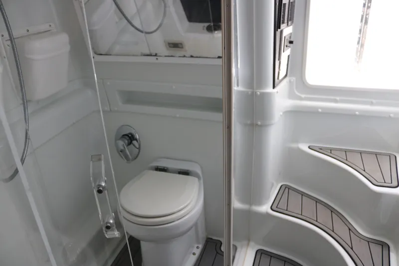 Slide: The Image of 2008 Yellowfin 42 Offshore boat bathroom with toilet and modern design. - 20
