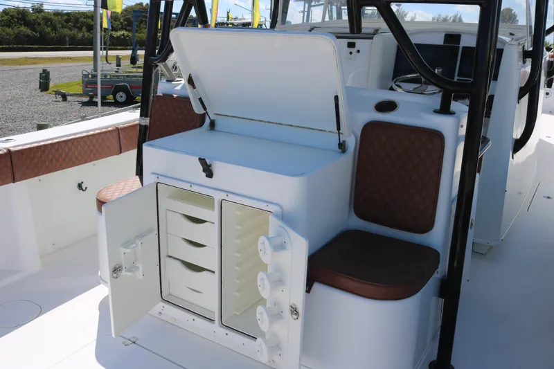 Slide: The Image of 2008 Yellowfin 42 Offshore boat interior with storage compartments and seating. - 23
