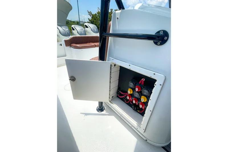 Slide: The Image of Open electrical panel on 2008 Yellowfin 42 Offshore boat, showcasing wiring and switches. - 28