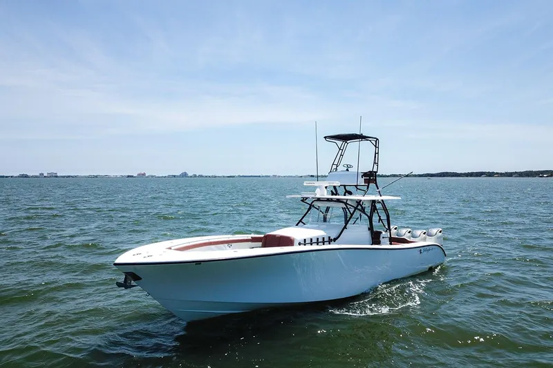 Slide: The Image of 2008 Yellowfin 42 Offshore boat cruising on open water under clear skies. - 3