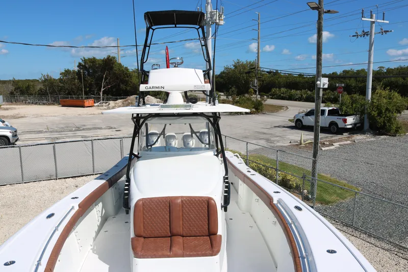 Slide: The Image of 2008 Yellowfin 42 Offshore boat with Garmin equipment, docked in a sunny outdoor setting. - 6