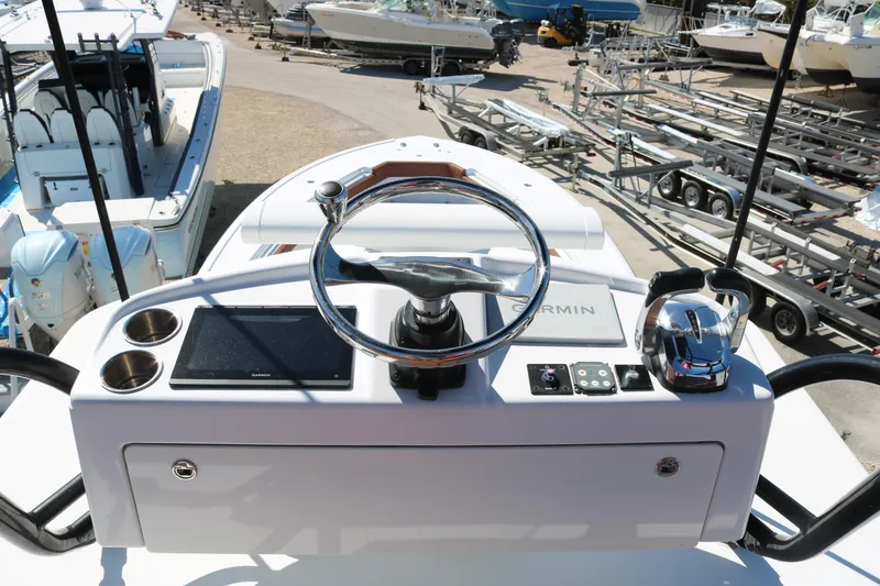 Slide: The Image of 2008 Yellowfin 42 Offshore boat helm with Garmin navigation and controls. - 8