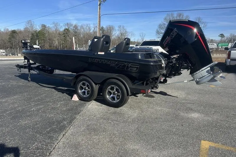Slide: The Image of 2026 Nitro Z19 XL Pro boat on trailer, parked outdoors. - 2