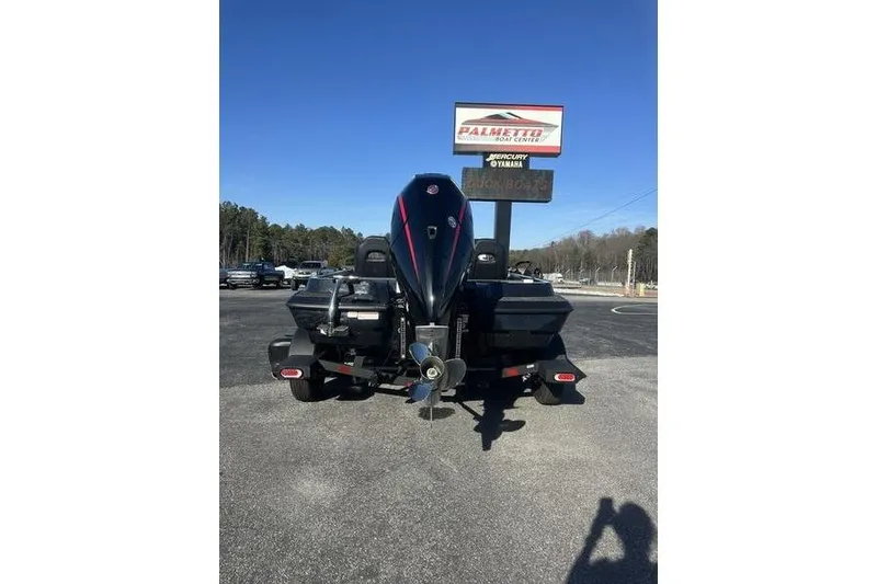 Slide: The Image of 2026 Nitro Z19 XL Pro boat rear view at dealership under clear blue sky. - 3