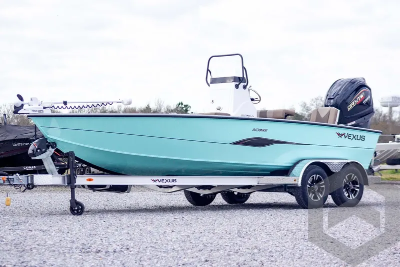Slide: The Image of 2026 Vexus ACX 2150 boat on trailer, turquoise hull, outboard motor, gravel lot. - 1